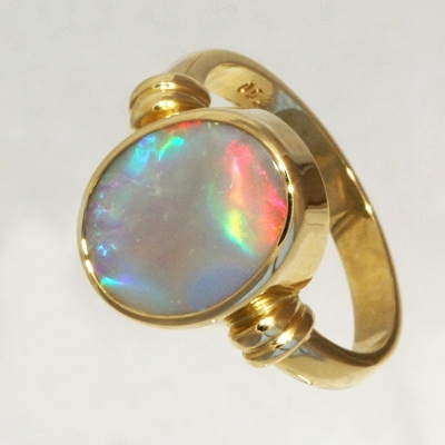 CUSTOM MADE 18k Yellow Gold Ring with a SOLID SEMI BLACK OPAL Large rolling flashes of bright red turning to peacock blue with a touch of green and purple